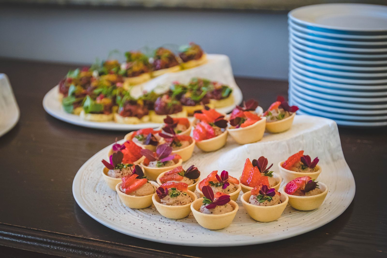 Trays of plated canapés ready for service